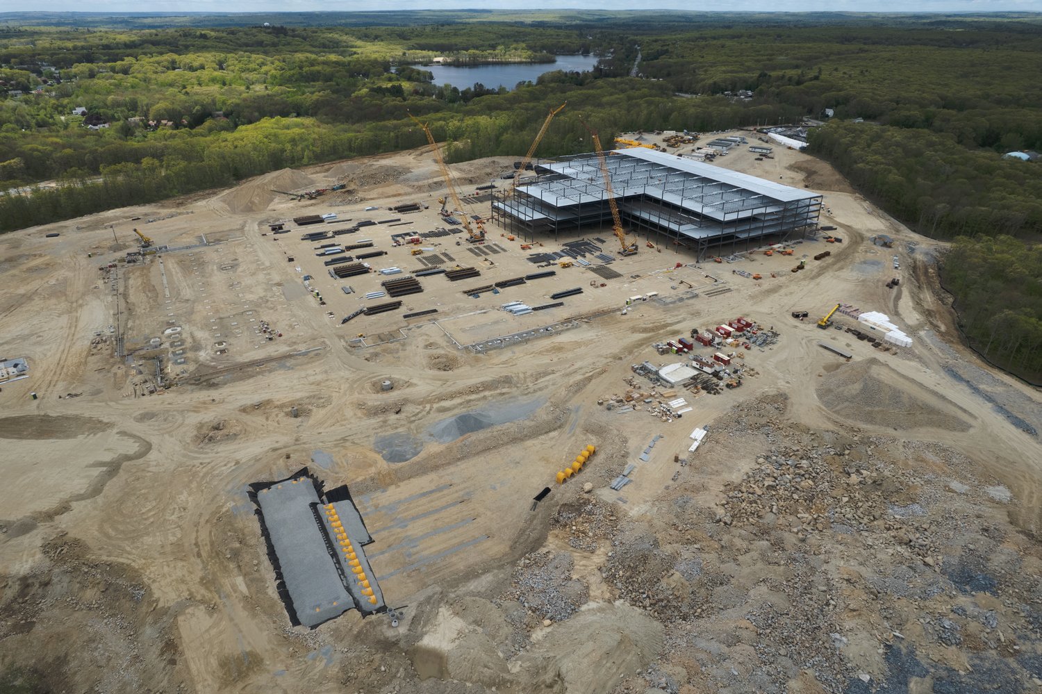 FROM THE AIR: These images of the Amazon construction site in Johnston were captured by drones piloted by Trevor Bryan, an FAA Licensed and insured drone pilot, the owner and operator of New England Aerial Services, on May 15. For more information on the Warwick-based company, visit their Facebook page at www.facebook.com/newenglandaerialservices.
